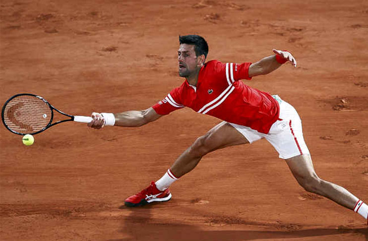 Djokovic saunters into French Open round two
